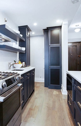 navy blue kitchen with floating shelf