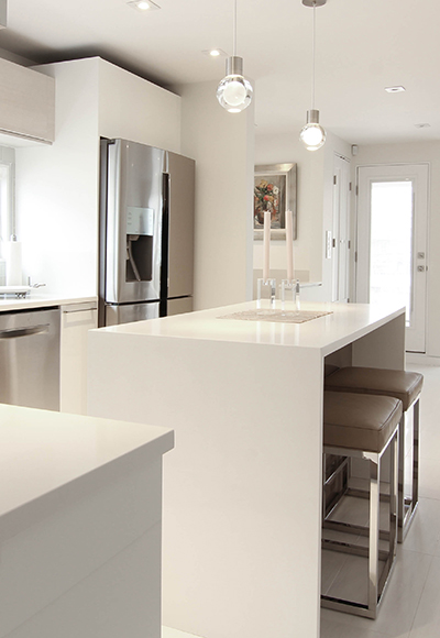 sleek white acrylic kitchen with waterfall