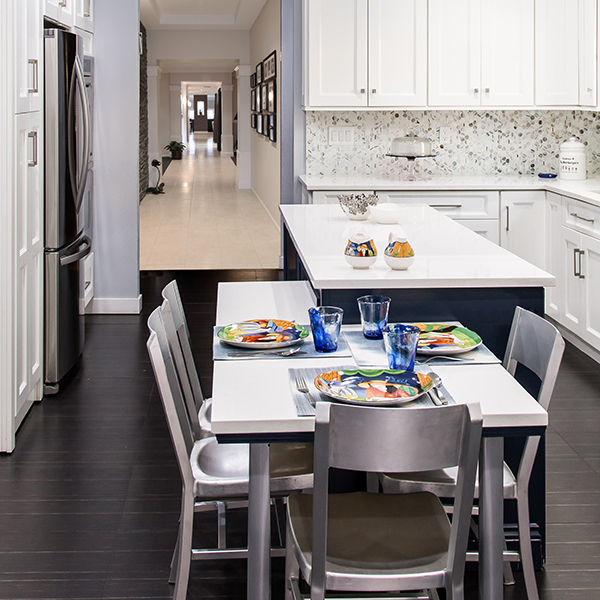 two tone kitchen with island with attached table