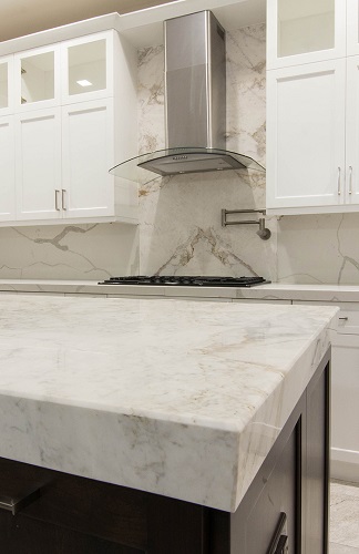 quartz counter with builtup white painted kitchen